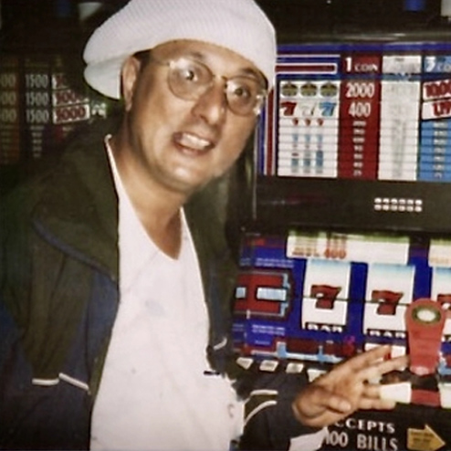A close-up photo of Salvatore Saranita in front of a slot machine