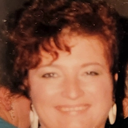 A close-up photo of Dolores "Dee" I. Morganti smiling at the camera