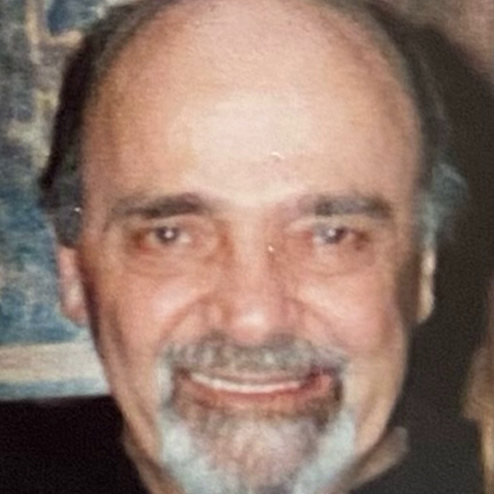 A close-up photo of Anthony J. Caruso smiling for the camera