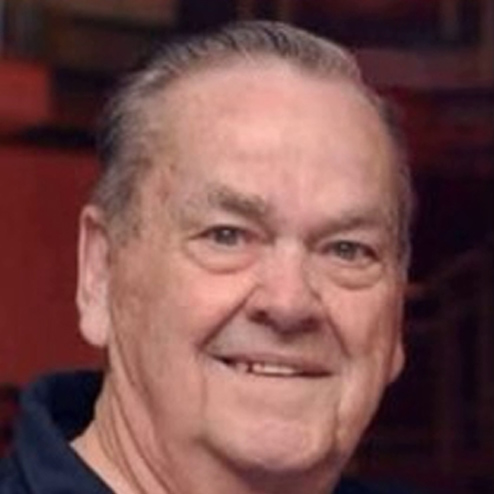 A close-up photo of Allen Ray Smith smiling for the camera