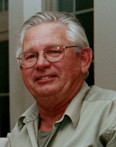 A close-up photo of Gerald K. Kramer smiling for the camera