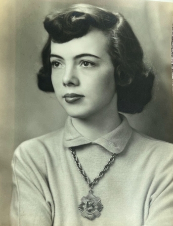 A black and white portrait photo of Dorothy E. Colwill looking serenely off into the distance